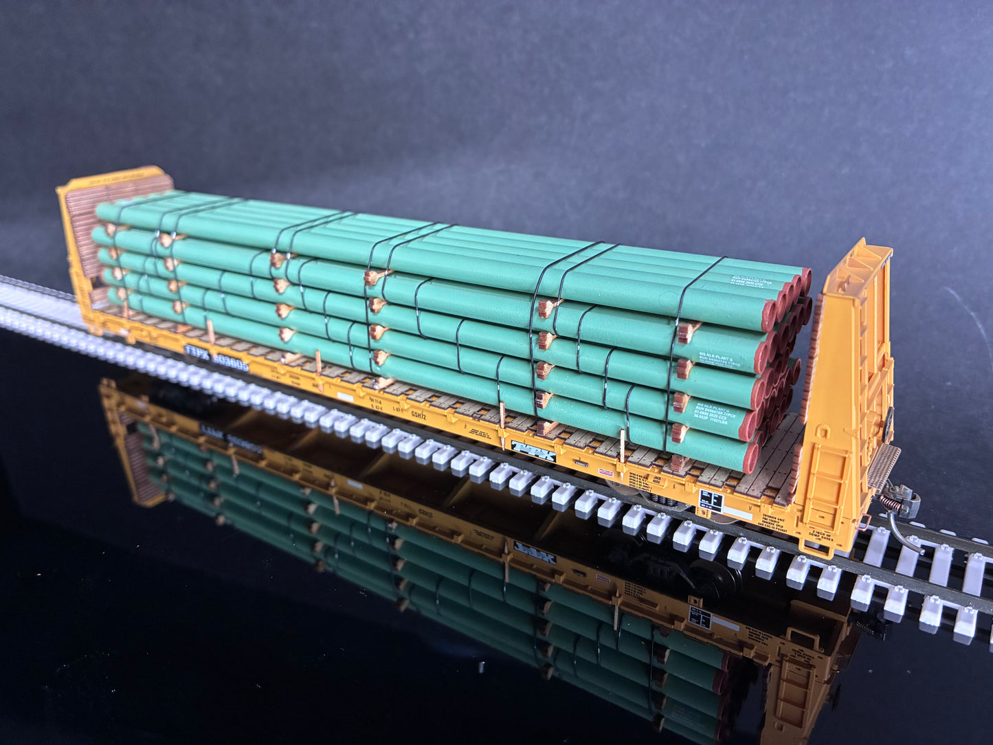 Atlas HO Scale 68' Bulkhead Flatcar with Steel Pipe